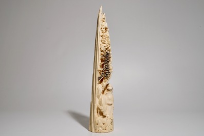 A Chinese carved ivory tusk with a marriage scene, ca. 1900